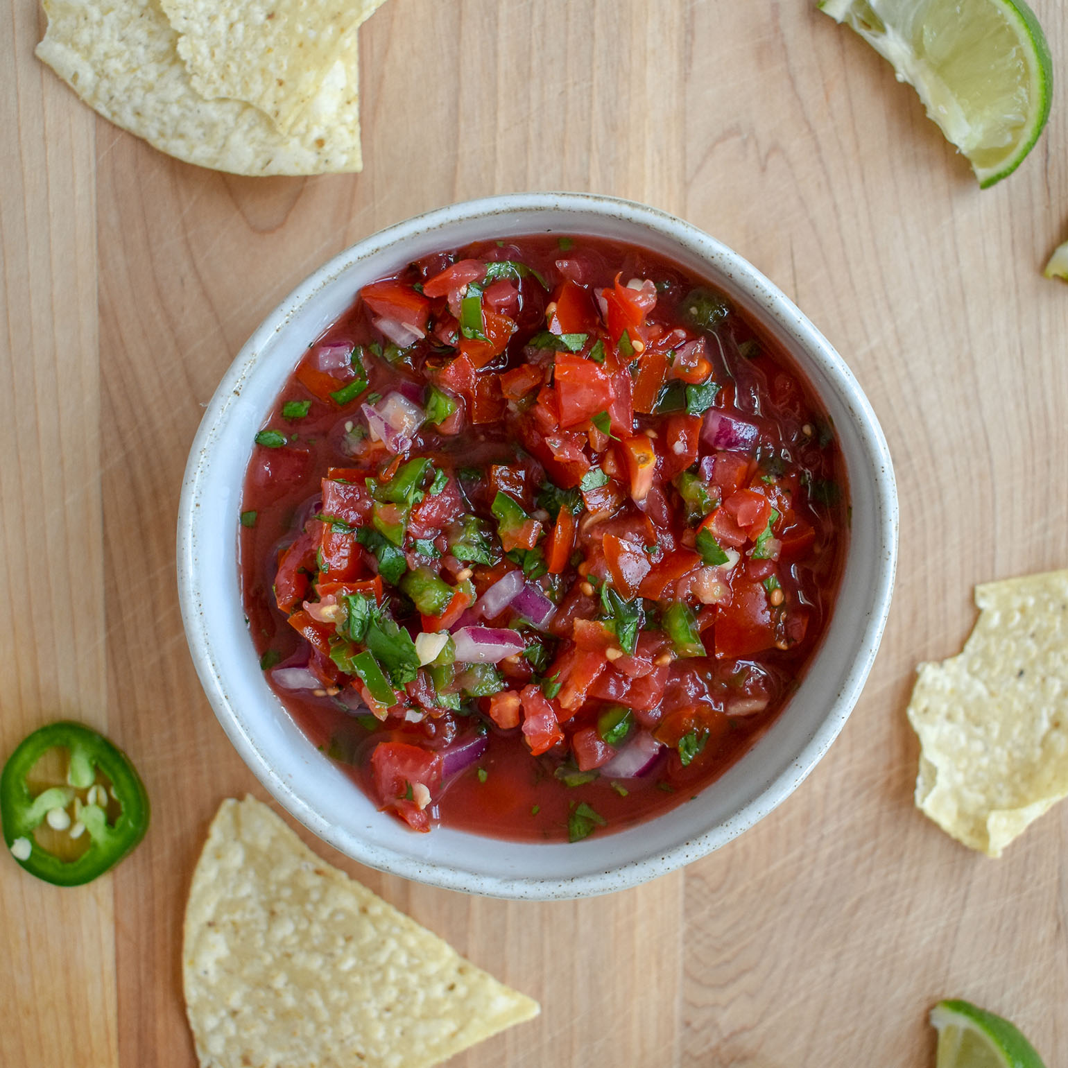 Simple homemade tomato salsa with tortilla chips