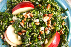 Kale quinoa apple salad in bowl