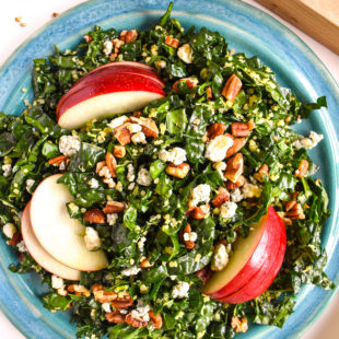 Kale quinoa apple salad in bowl