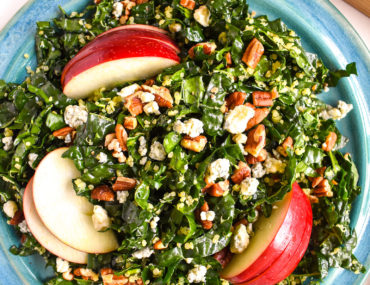 Kale quinoa apple salad in bowl